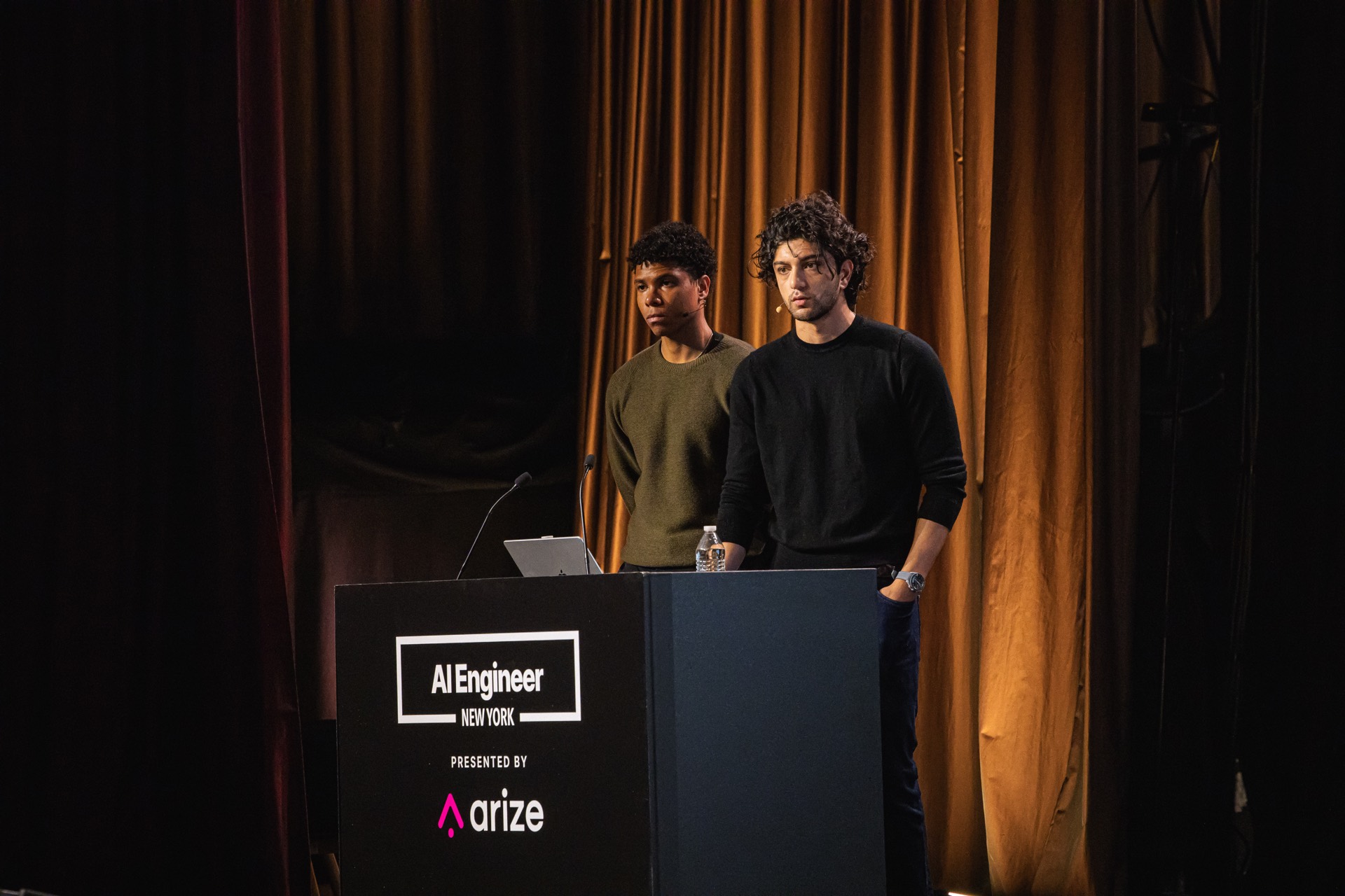 Affaan Mustafa and Alejandro Soumah Fernandez behind the AI Engineer New York lectern.